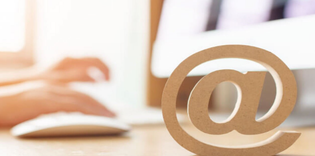 Woman's hands writing an email