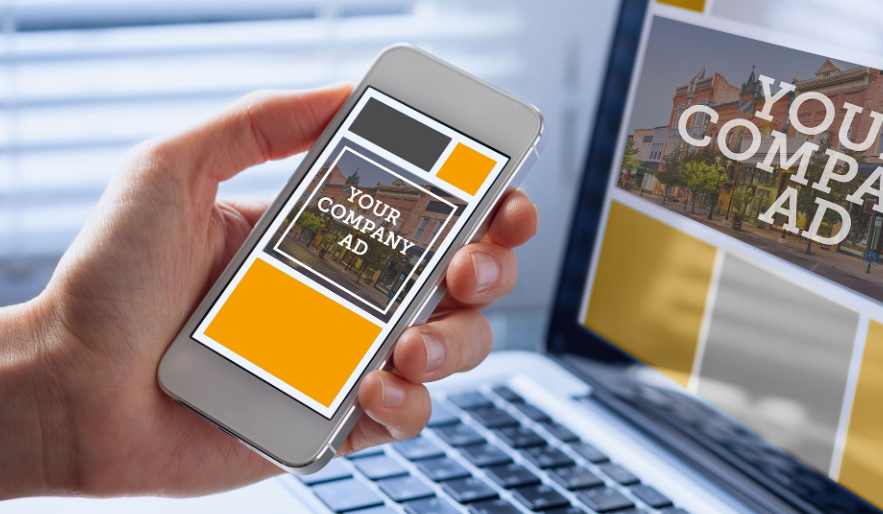 Phone and laptop screens showing space for ads with text reading "Your Company Ad"