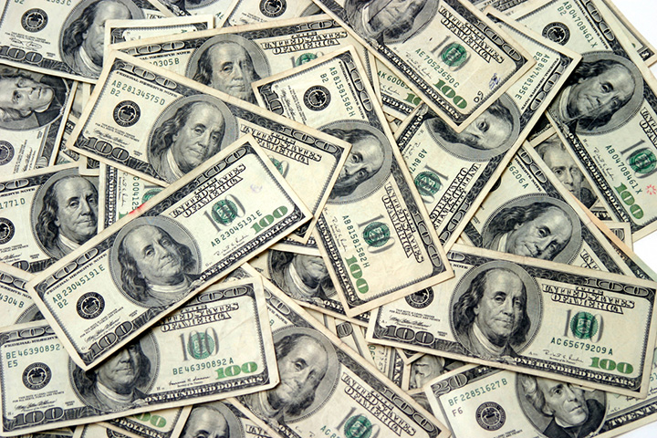 Pile of one hundred dollar bills