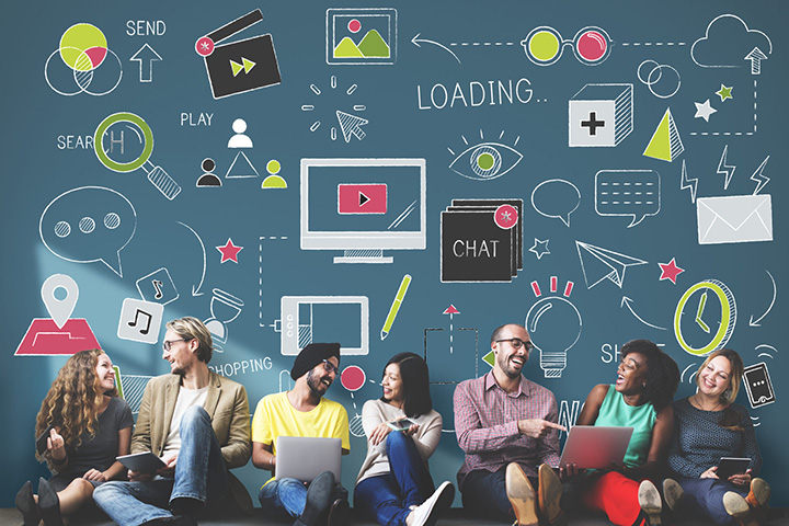Line of people sitting together with illustrations of chalk drawings representing computer icons above them